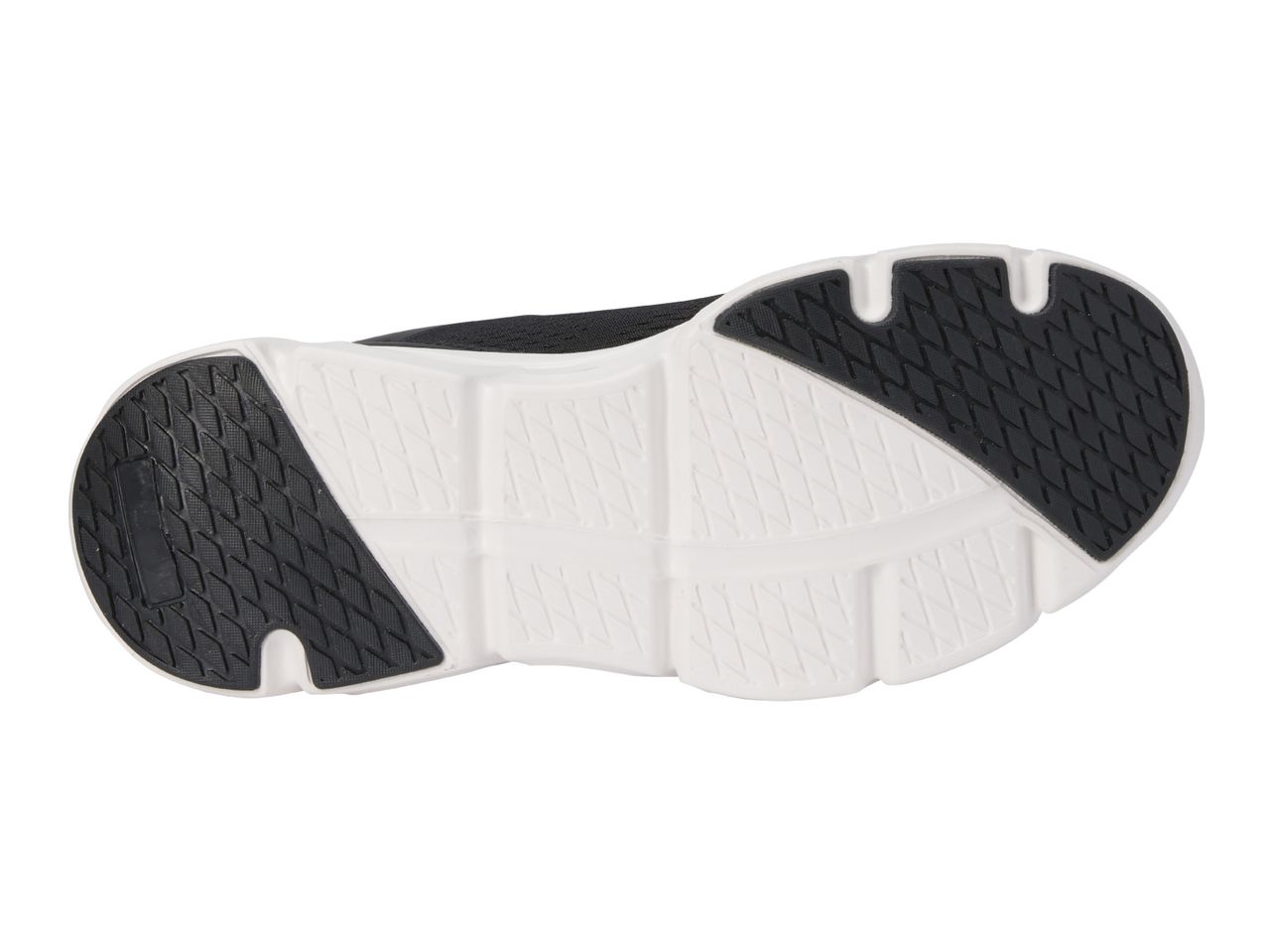 Black and white athletic shoe sole with textured grip patterns.