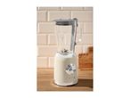 Retro-style cream blender with a glass jug on a wooden countertop.