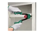 Hands in work gloves using a rivet gun to fasten a metal shelf.