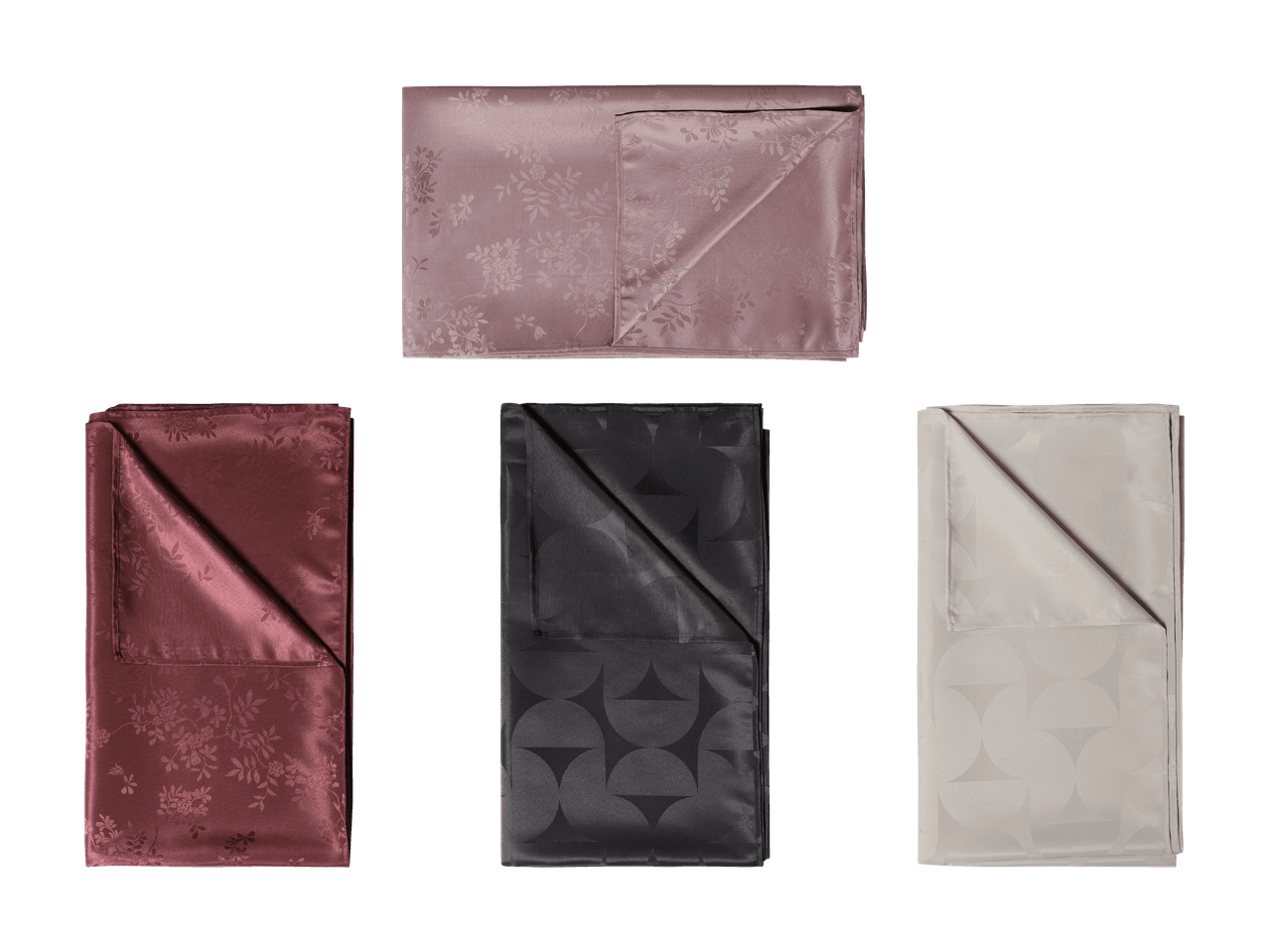 Drei gefaltete Tischdecken in Rosa, Bordeaux, Schwarz und Beige mit Blumen- und geometrischen Mustern.