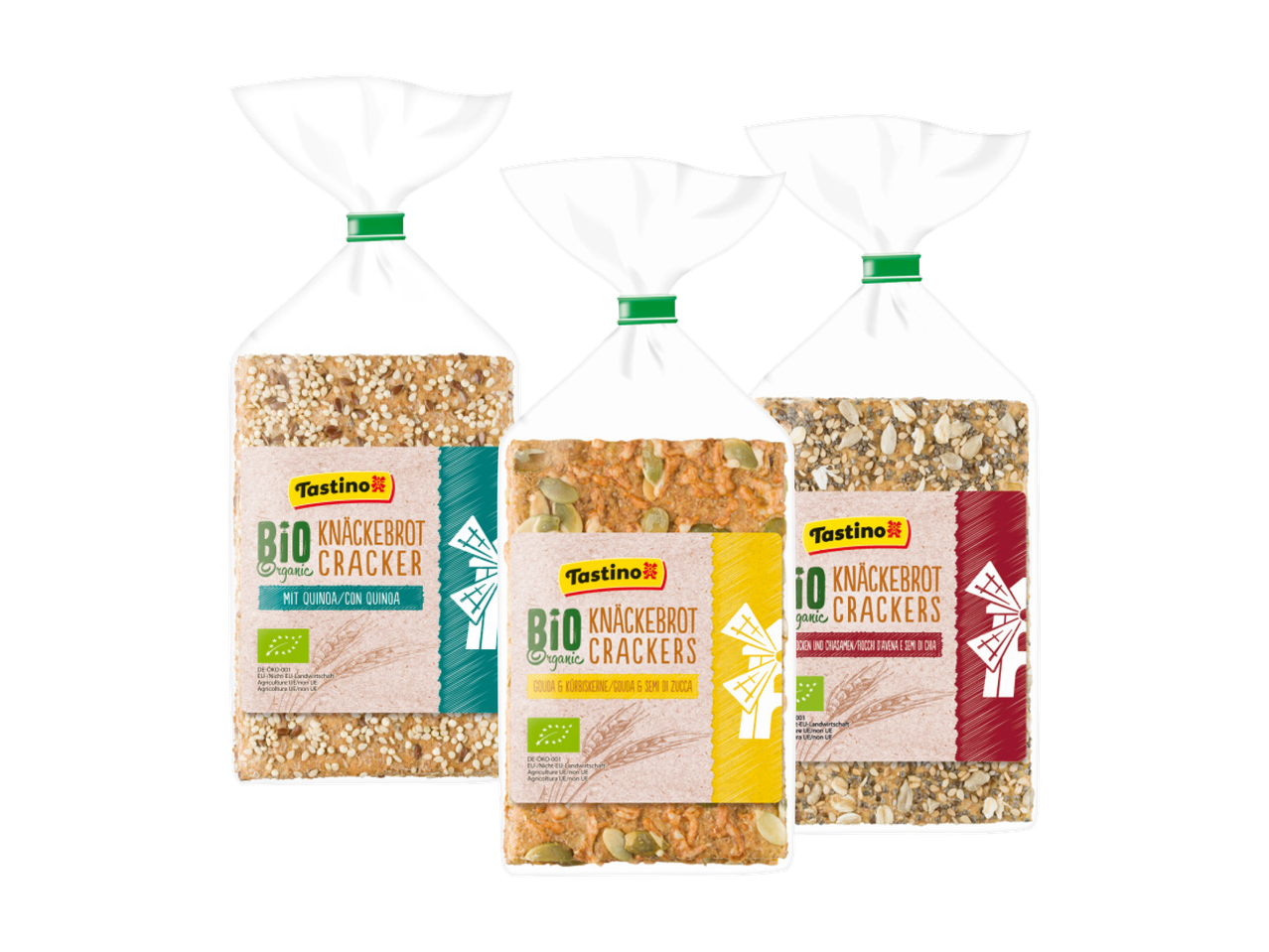 Tre confezioni di cracker biologici Tastino, con gusti diversi come quinoa, semi di zucca e avena.