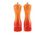 Two orange and red gradient salt and pepper grinders with silver tops.