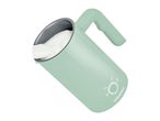 A light green SilverCrest milk frother with white foam inside, angled on a white background.