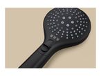 Close-up of a black shower head with multiple spray settings and grey nozzles.