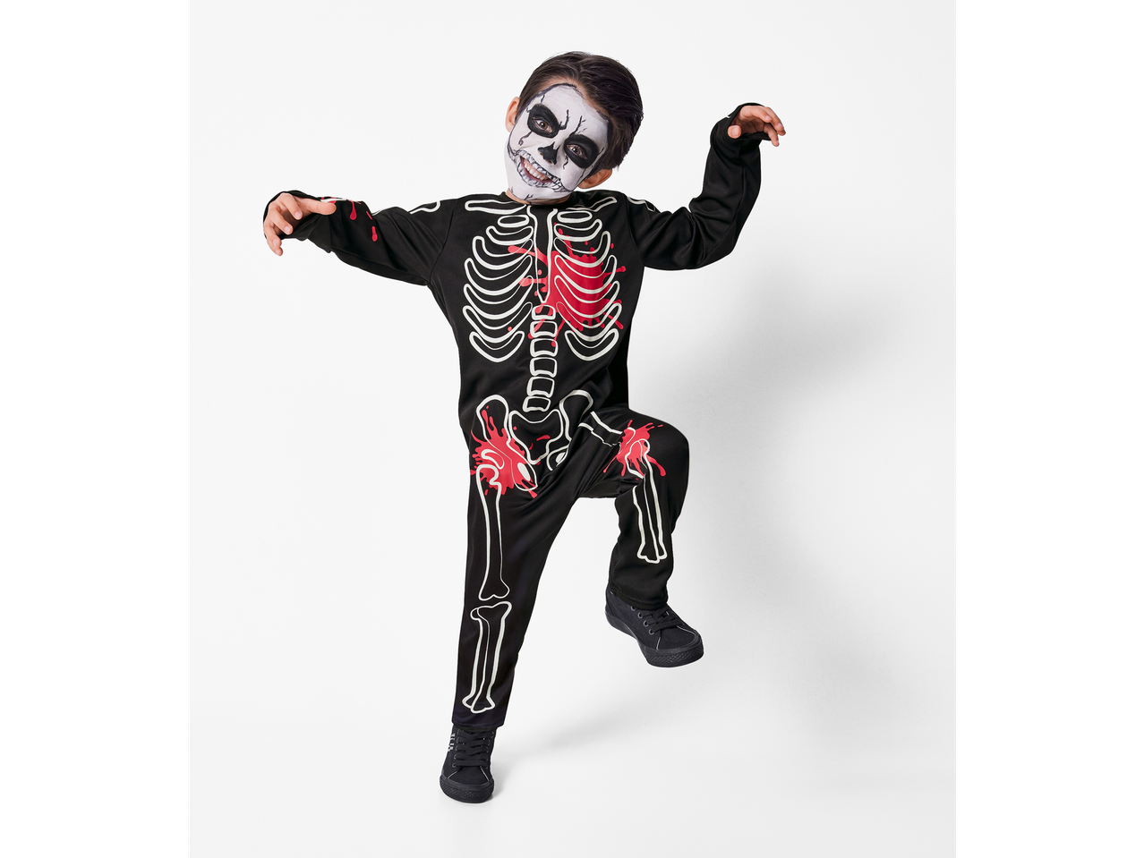 Boy in a black skeleton costume with red blood splatters and skeleton face paint.