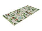 Kids' play rug with a town map design, featuring roads, houses, a school, and a pond.