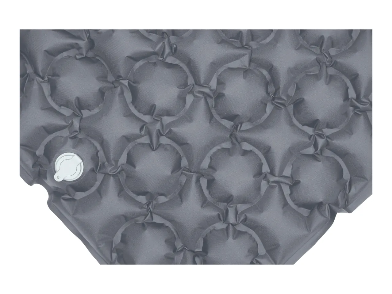 Close-up of a grey inflatable sleeping mat with a white valve