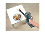Beldray Cordless Vacuum Cleaner cleaning croissant crumbs from a white table.