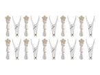 Eighteen white plastic clothespins arranged in rows.