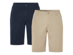 Dvoje muških kratkih hlača, jedne tamnoplave i jedne bež boje, s elastičnim pojasom.