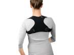 Woman wearing a black posture corrector.