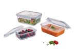 Three glass food containers with lids, filled with salad, berries, and soup.