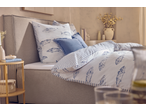 Bedroom with Livarno Jersey Fitted Sheet, fish-patterned duvet, and blue pillows.