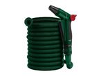 A coiled green garden hose with a dark green spray gun attached, featuring a red trigger.