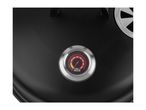 Close-up of a black grill lid with a built-in thermometer showing temperatures in Celsius.