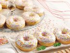 Glazed donuts with colorful sprinkles.