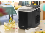 SILVERCREST® Ice Maker on a table with drinks and ice, ready for a party.