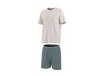A light beige t-shirt with a pocket and dark teal shorts.