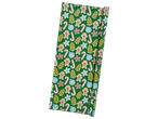 Crelando wrapping paper with gingerbread men, candy canes, and Christmas trees on a green background.