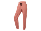 CRIVIT joggingbroek in perzikkleur met zwarte trekkoorden en geribbelde boorden.