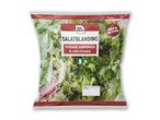 En pose med salatblanding indeholdende feldsalat, endiviesalat og radicchio, klar til brug.