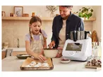 Father and daughter baking cookies with a Monsieur Cuisine food processor.