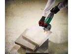 Person cutting a slab with a Parkside Performance® PWS 125 angle grinder.