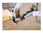 Person cutting a copper pipe with an angle grinder, creating sparks.