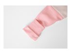 Close-up of a pink and beige color block sweatshirt sleeve.