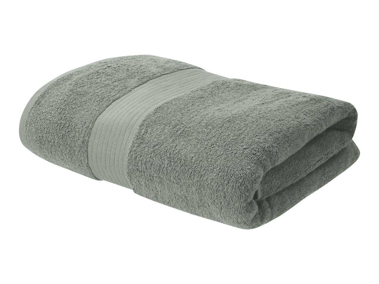 Folded sage green bath towel with a ribbed border, isolated on a white background.