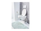 Modern bathroom with a wall-mounted toilet, toilet paper holder, and a light blue bath mat.