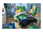 A child's bedroom with a bed featuring a black and green duvet with 'SURVIVAL' text, and a green pillow.