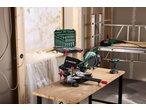PARKSIDE® angle grinder, miter saw, and drill on a workbench with a tool set.