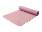 Pink yoga mat, partially rolled up, with a textured surface.