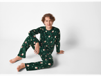Boy in green esmara® Kids' Christmas Velour Pyjamas with Santa and tree print.