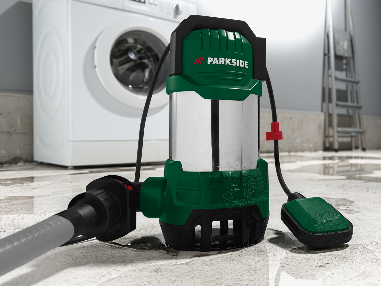 Parkside® 1100W Submersible Dirty Water Pump in a flooded basement with a washing machine.