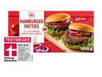 Verpackung für tiefgekühlte Hamburger-Patties mit zwei fertigen Burgern und der Aufschrift „TESTSIEGER GUT (2,3)“.