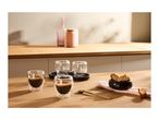 Espresso in double-walled glasses with biscotti on a wooden counter.