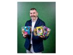 A man holding three Slim's Healthy Kitchen ready meals against a green background.