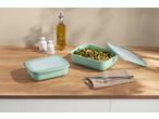 SILVERCREST® Food Container Set with salad, oil, and salt and pepper shakers on a wooden table.