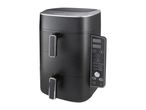 Black dual-basket air fryer with digital display showing cooking modes like reheat, air fry, roast, and bake.