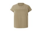 En beige t-shirt med broderi på skuldrene.