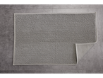 LIVARNO home gray bath mat with a textured bobble surface on a tiled floor