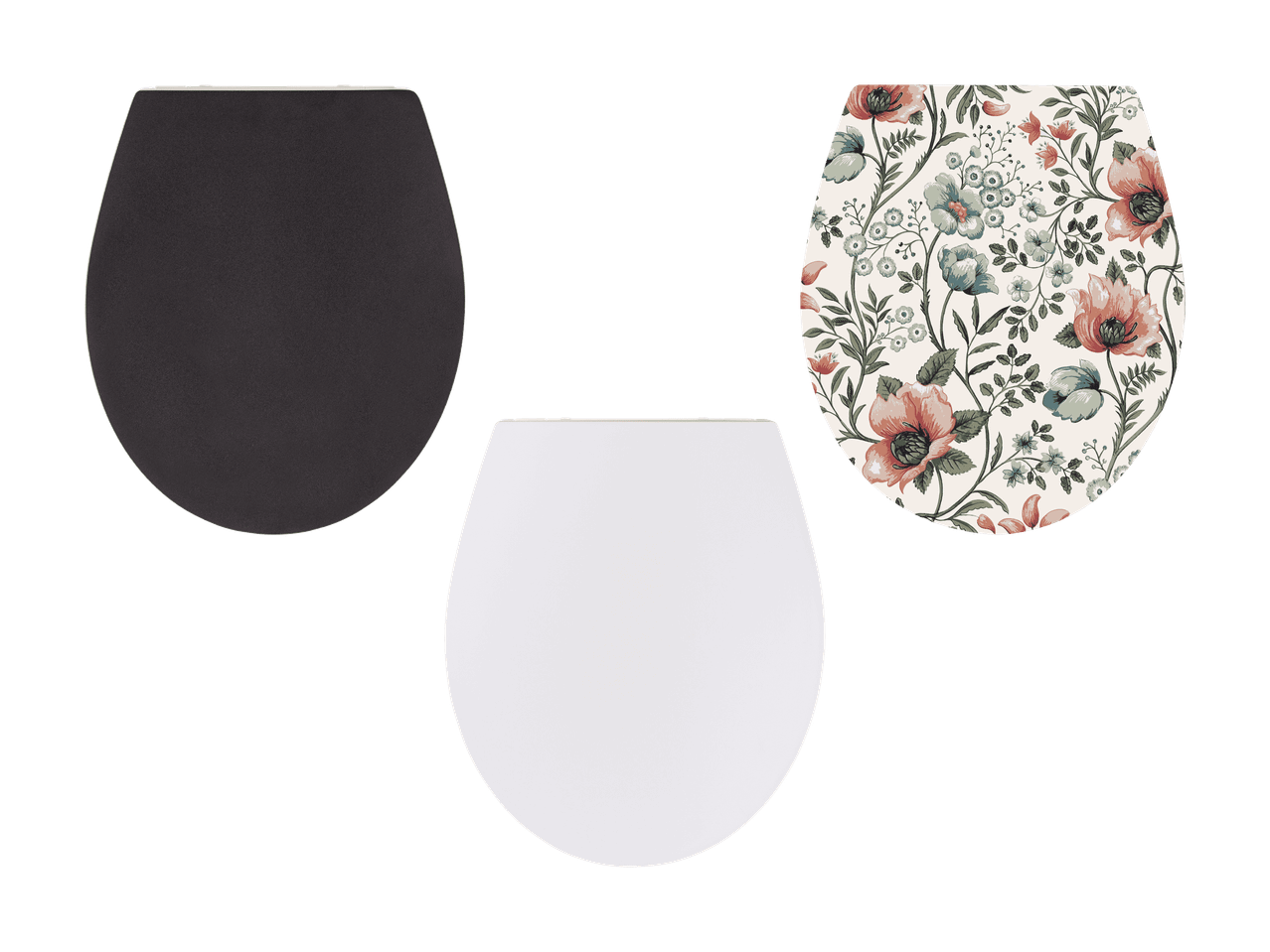 Trois abattants de toilettes : un gris foncé, un blanc et un à motifs floraux.
