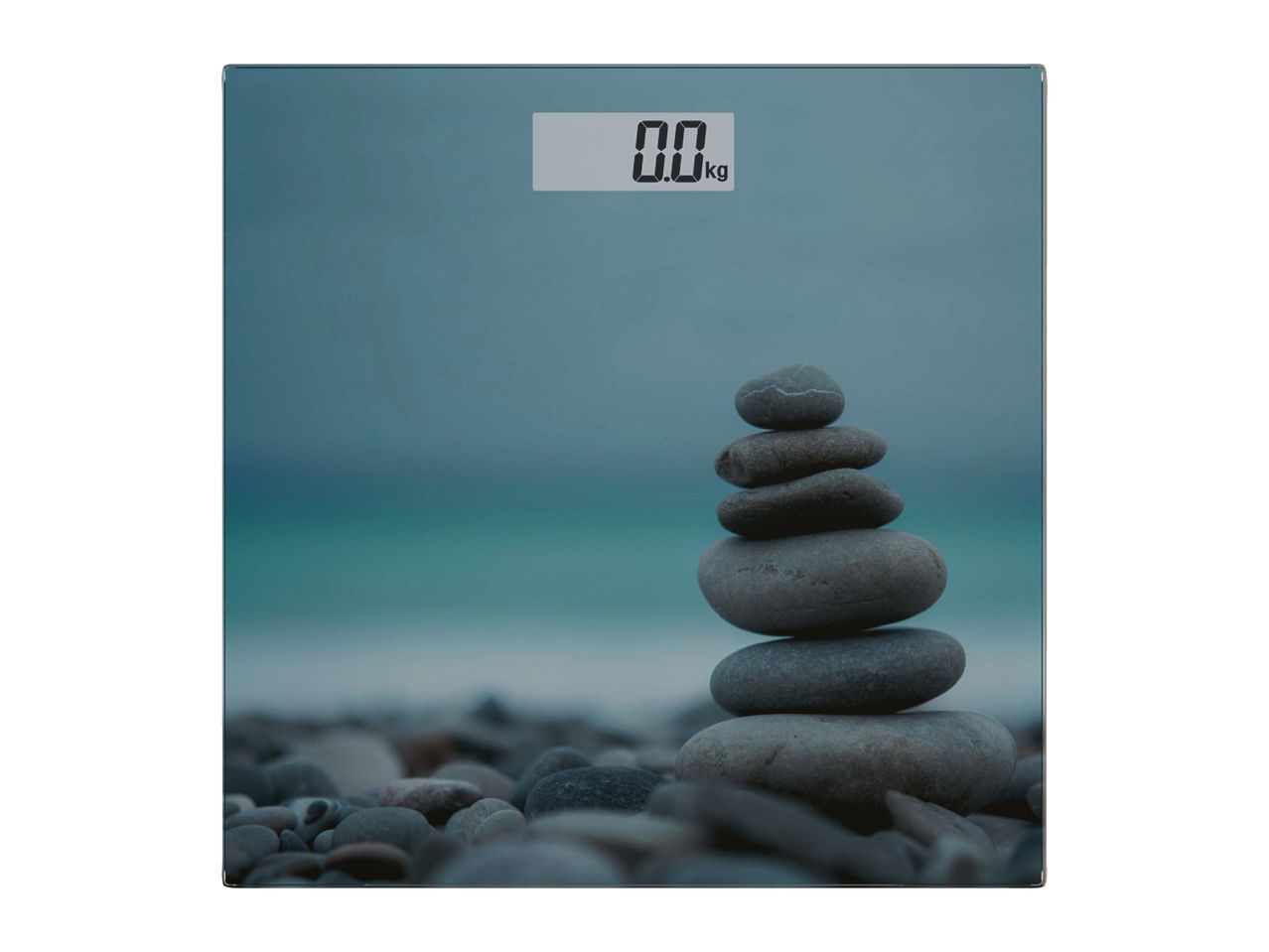Bathroom scale with a serene beach and stacked stones design, displaying '0.0 kg'.