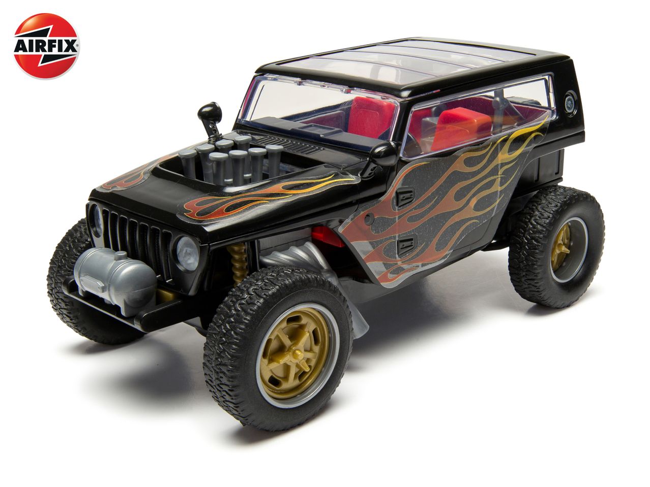 Black toy off-road vehicle with flame decals and exposed engine on a white background.