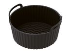 Black silicone air fryer basket with handles and a wavy textured bottom.