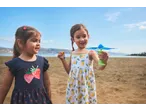 Two girls playing with Lupilu Outdoor Toy Sets on a sandy beach.