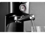 Black espresso machine with pressure gauge.