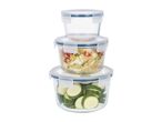 Stack of three round glass food containers with blue-rimmed lids, two filled with food.